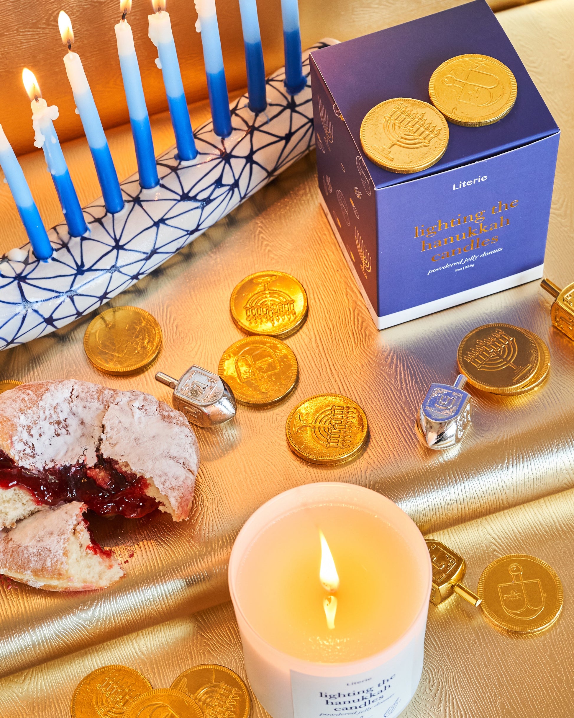 hanukkah candle with jelly donut.