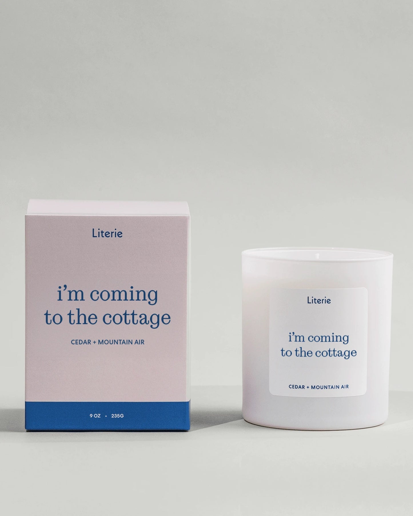 Heated Rivalry inspired candle called 'i'm coming to the cottage' with box on light grey background.