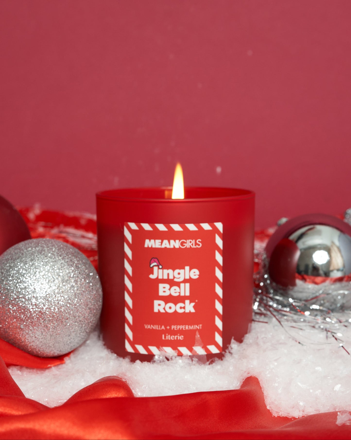 Mean Girls jingle bell rock candle with ornaments.