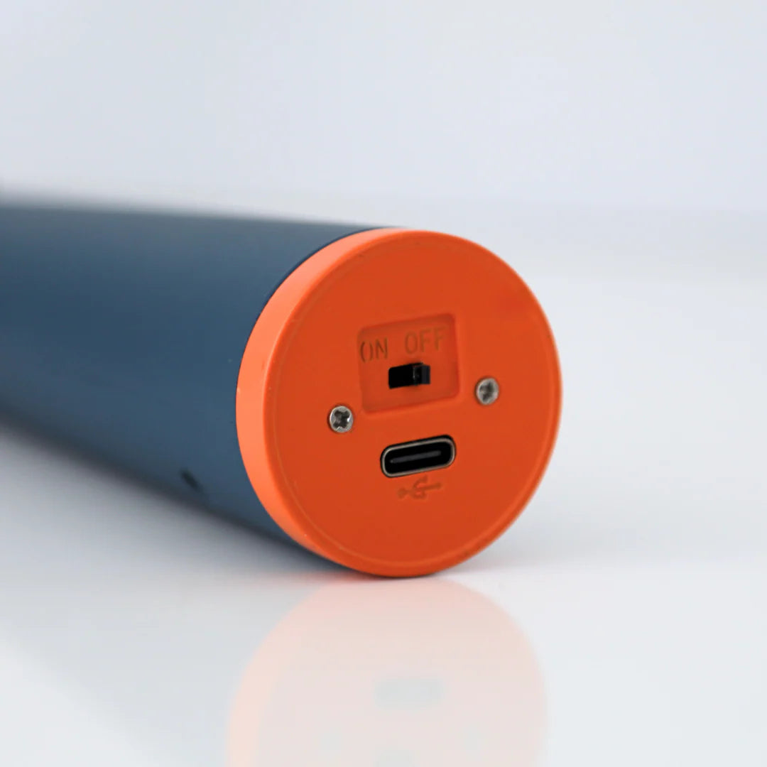 Lighter with orange charging bottom on a light gray background.