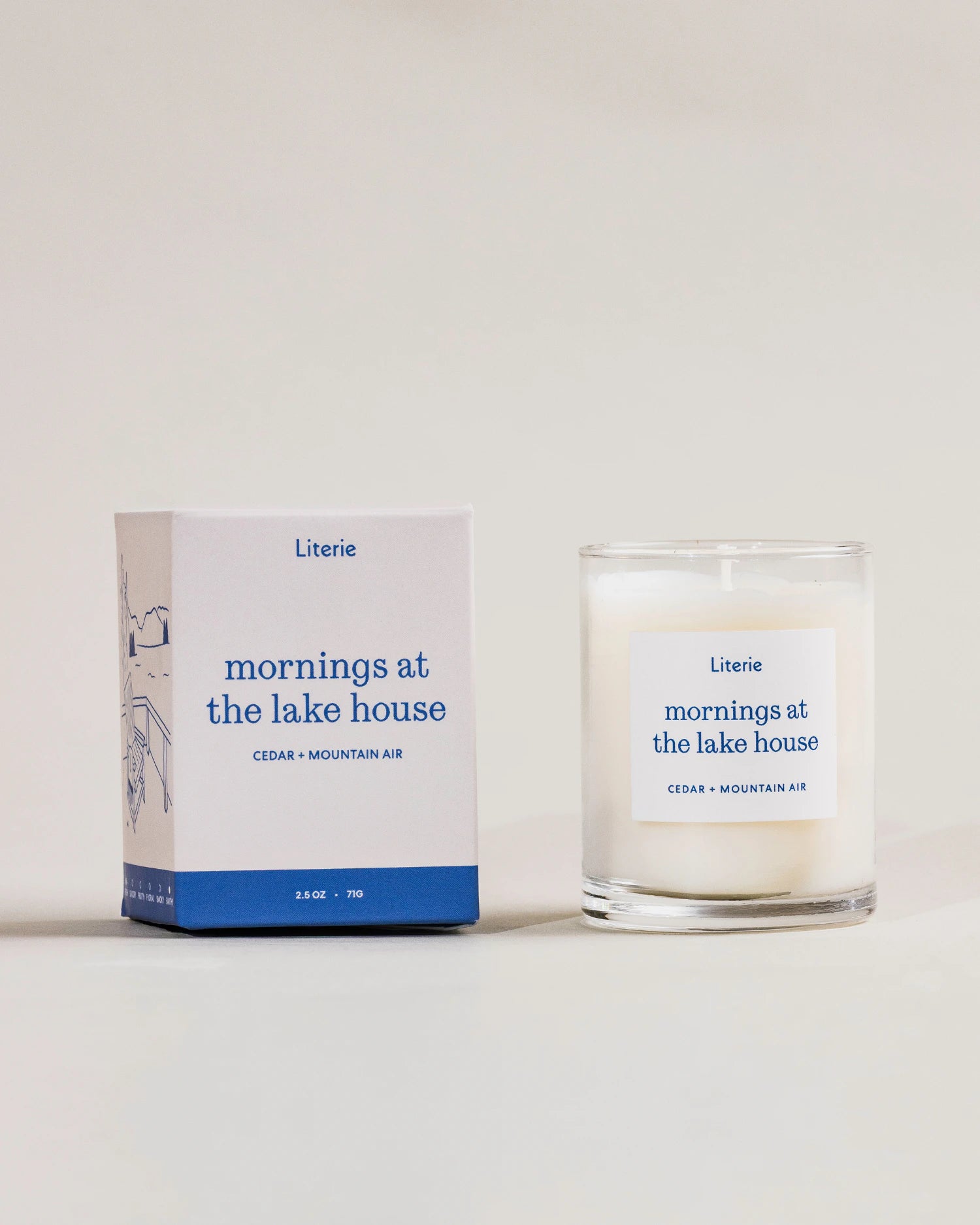 Little candle and packaging labeled 'mornings at the lake house' by Literie on a white background