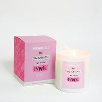 A scented candle with a label that reads 'On Wednesdays we wear pink', alongside its pink-themed packaging box, with 'MEAN GIRLS' and 'Paramount Pictures' branding.