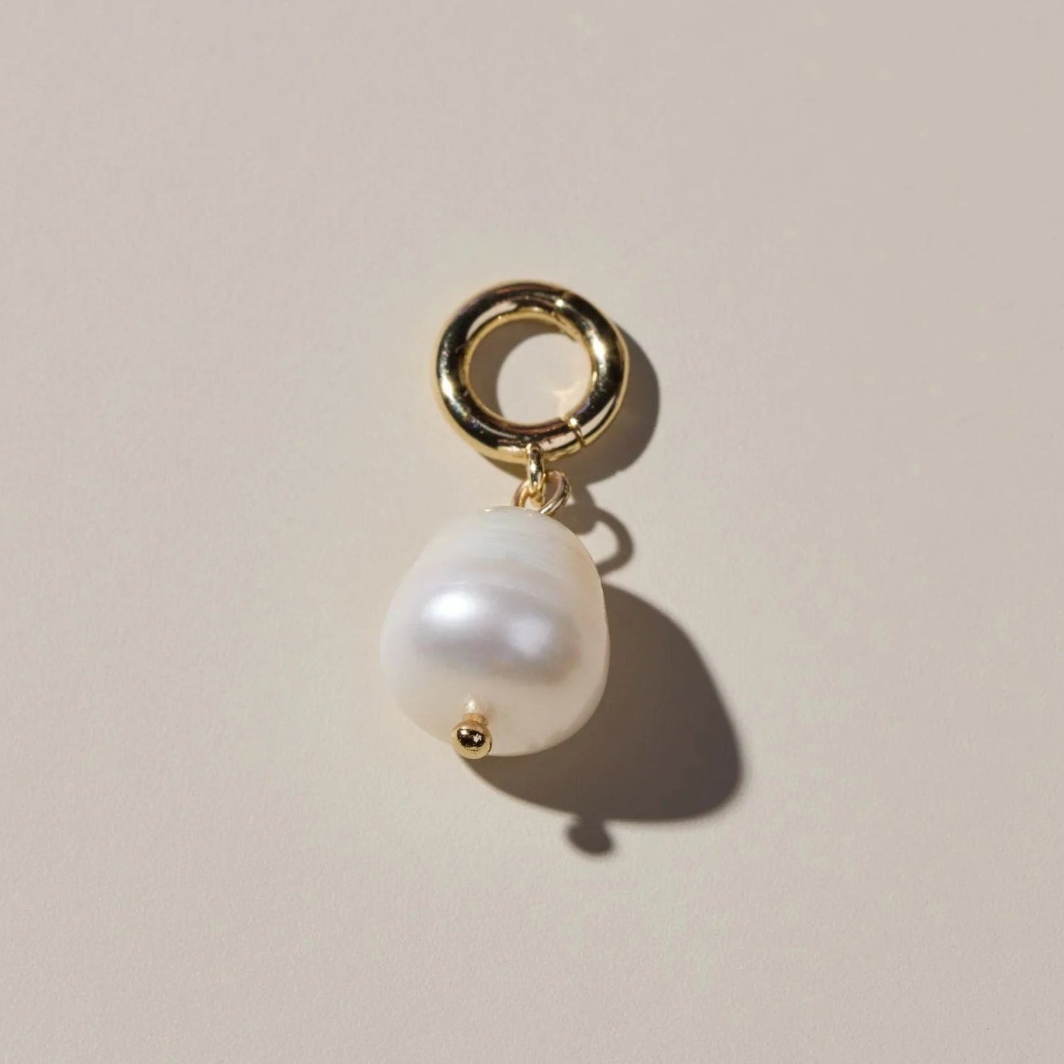 Real pearl charm to add to bracelet or earring.