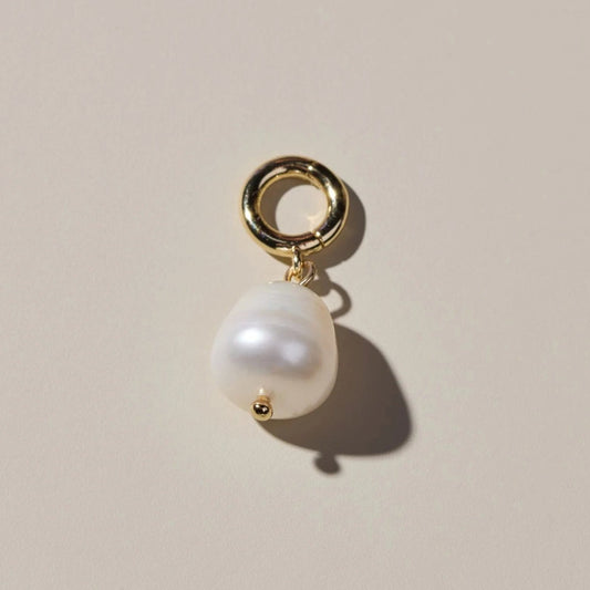 Real pearl charm to add to bracelet or earring.