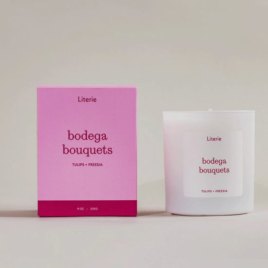 'bodega bouquets' candle box spinning with the candle next to it.