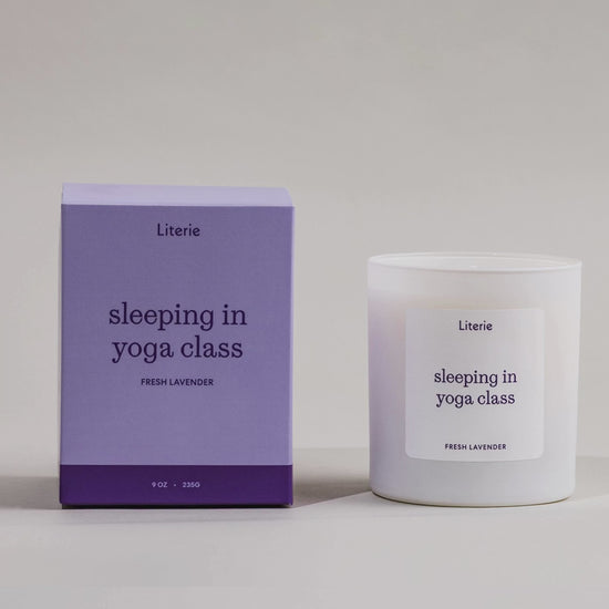 Sleeping In Yoga Class candle box spinning next to the candle.