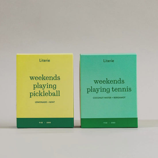 'weekends playing pickleball' and 'weekends playing tennis' candles boxes on a neutral background turning 360.