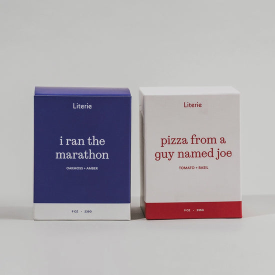 'i ran the marathon' and 'pizza from a guy named joe' candle duo boxes turning.