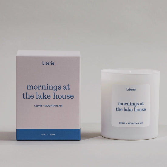 Mornings At The Lake House candle box spinning next to the candle.