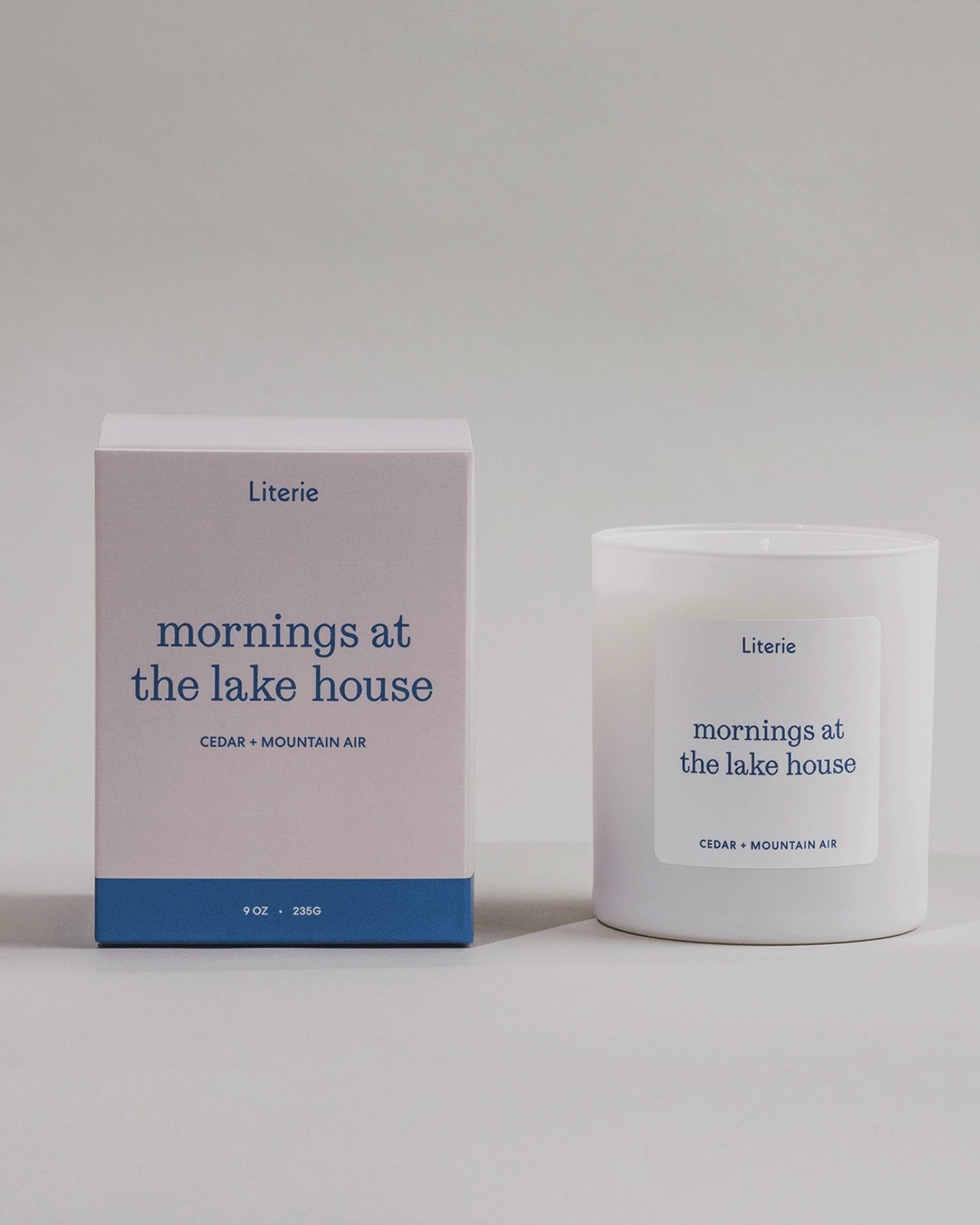 Mornings At The Lake House candle box spinning next to the candle.