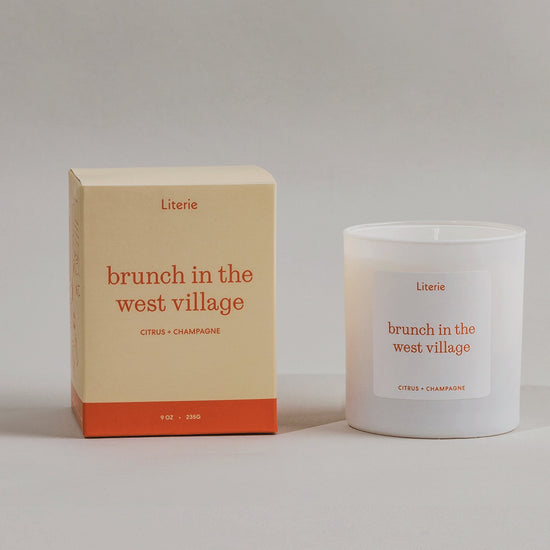 Brunch In The West Village candle box spinning next to the candle.