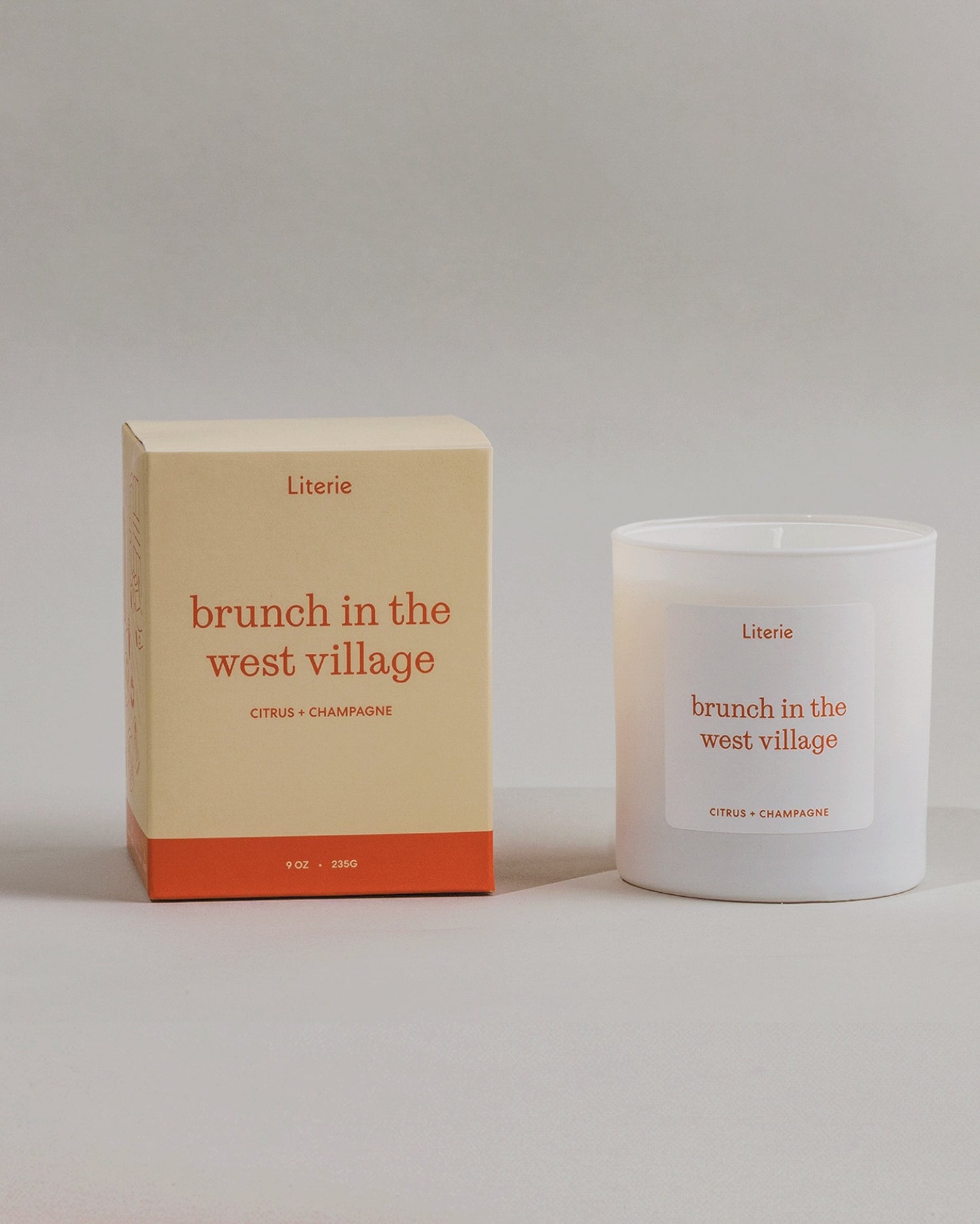 Brunch In The West Village candle box spinning next to the candle.