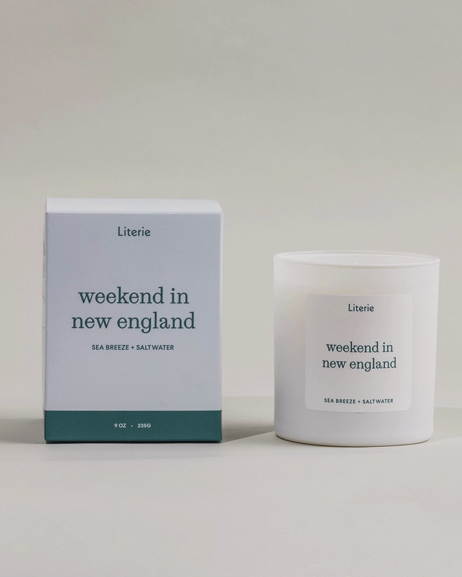 Weekend In New England candle box spinning next to the candle.