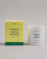 Weekends Playing Pickleball candle box spinning next to the candle.