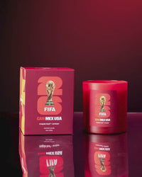 Literie candle for FIFA World Cup Team Canada spinning with box on red background.