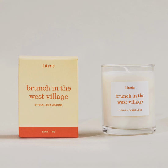Brunch in the west village little candle box rotating 360º with candle next to it