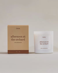 Afternoon at the Orchard candle box turning 360° next to it's candle.