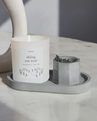 skiing out west candle with grey tray and grey matches gift set.