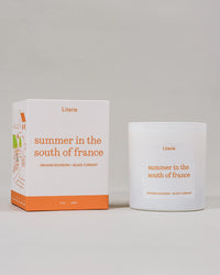 Candle and packaging of 'Summer in the South of France' by Literie on a light gray background