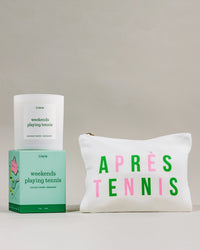 Pouch with 'après tennis' text and 'weekends playing tennis' candle on a neutral background