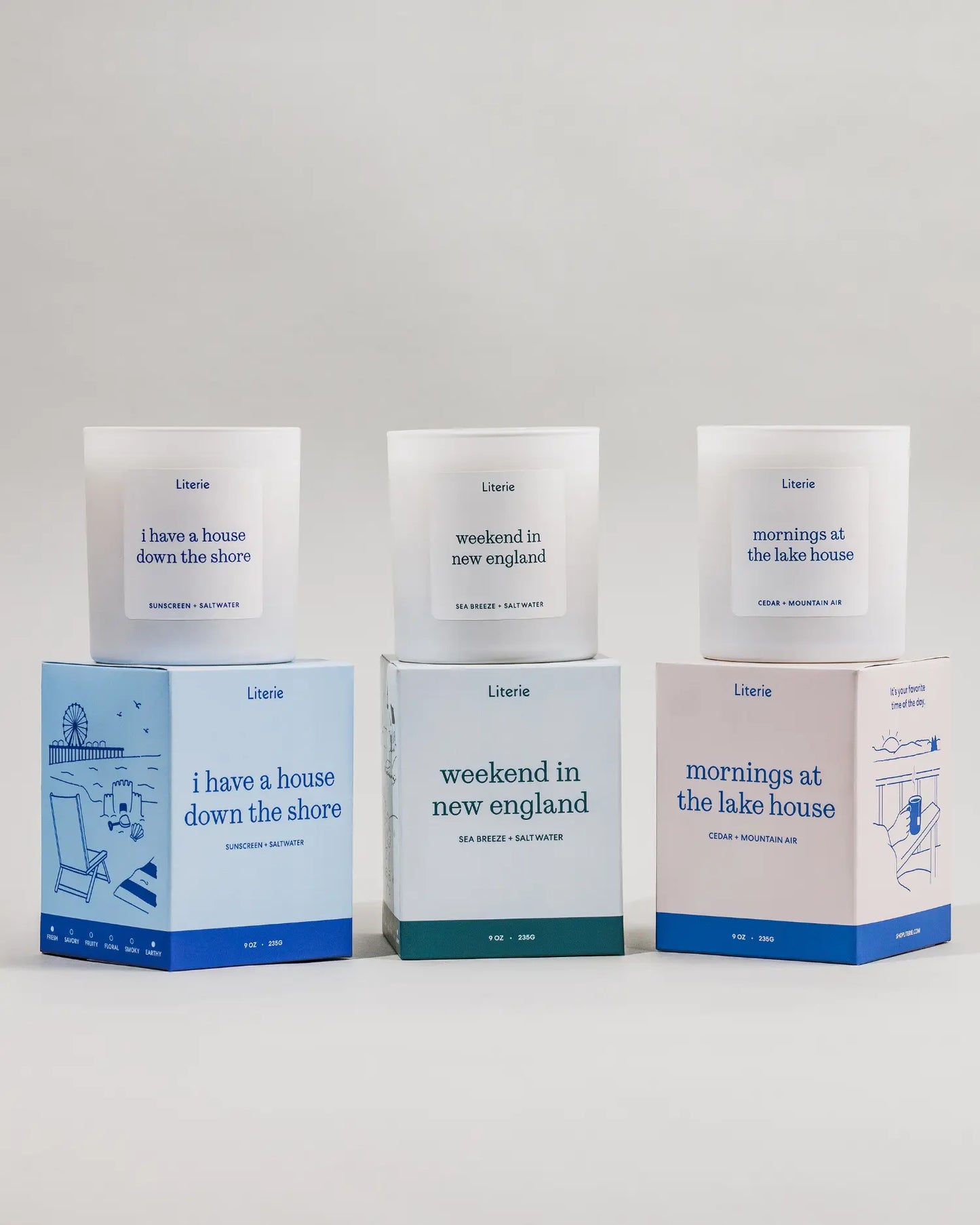 Weekend Getaway Trio including 3 candles and boxes on a light gray background