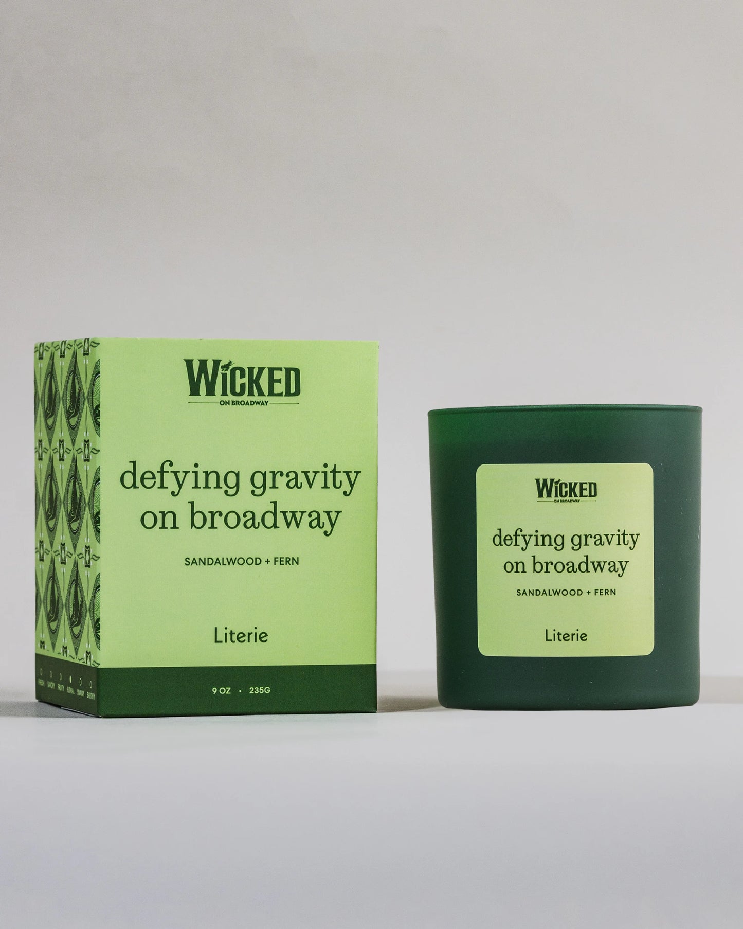 Wicked on Broadway candle named 'defying gravity on broadway' next to packaging.