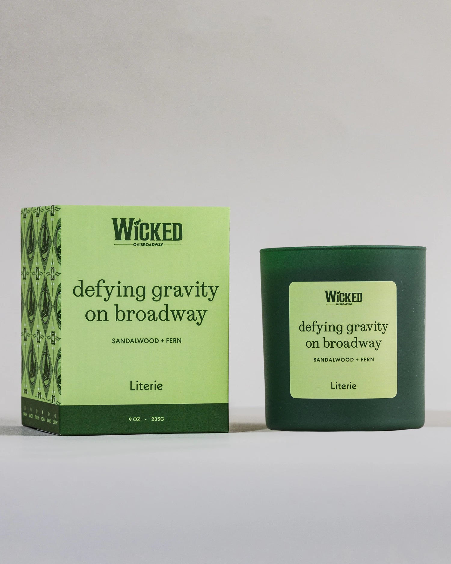 Wicked on Broadway candle named 'defying gravity on broadway' next to packaging.