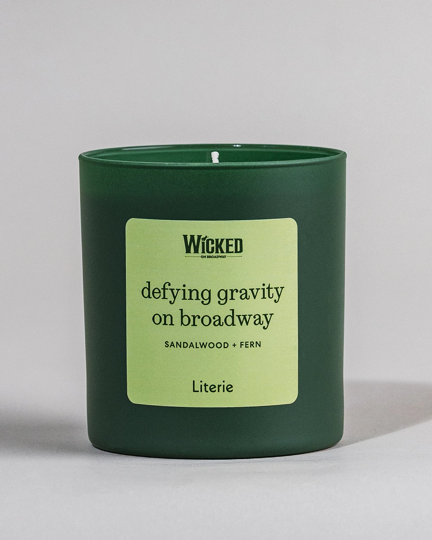 Wicked on Broadway candle named 'defying gravity on broadway' on grey background.