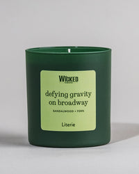 Wicked on Broadway candle named 'defying gravity on broadway' on grey background.