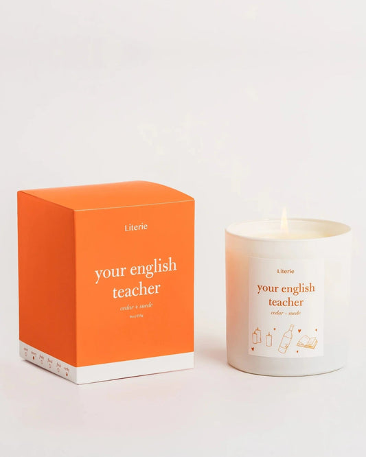 Candle and packaging with 'your English teacher' text on a white background
