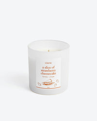 Cheesecake candle on white background.
